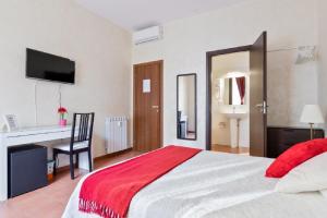 Posteľ alebo postele v izbe v ubytovaní Roma Enrico Guesthouse