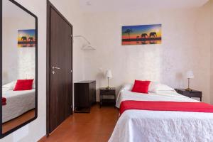 Posteľ alebo postele v izbe v ubytovaní Roma Enrico Guesthouse