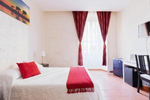 Posteľ alebo postele v izbe v ubytovaní Roma Enrico Guesthouse