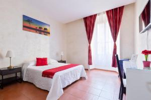 Posteľ alebo postele v izbe v ubytovaní Roma Enrico Guesthouse