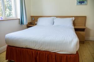 Voodi või voodid majutusasutuse Kerry-Lee Holiday Homes Tralee toas