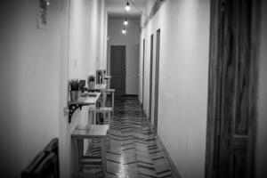 a hallway with tables and chairs in a room at Cloud 9 Living in Bucharest