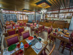 an overhead view of a restaurant with tables and chairs at Lucky Cave Hotel Cappadocia in Goreme