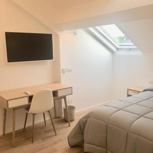 A television and/or entertainment centre at CORSO VENEZIA APARTMENT