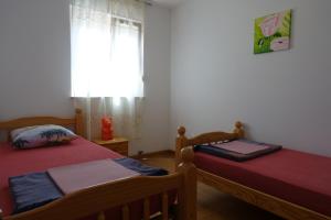 
Krevet ili kreveti u jedinici u objektu Apartments Dalmatina

