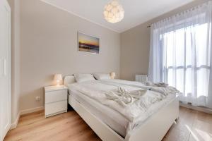 Un pat sau paturi într-o cameră la Loft Apartments