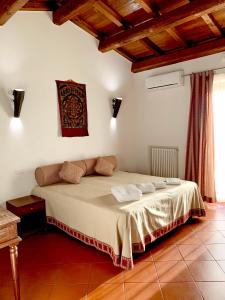 Postel nebo postele na pokoji v ubytování Resort Fonte Vulci
