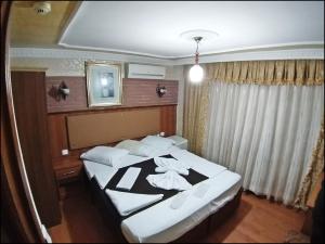 Postel nebo postele na pokoji v ubytování Istanbul Sydney Hotel