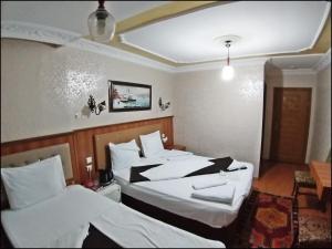 Postel nebo postele na pokoji v ubytování Istanbul Sydney Hotel