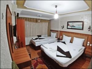 Postel nebo postele na pokoji v ubytování Istanbul Sydney Hotel