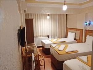 Postel nebo postele na pokoji v ubytování Istanbul Sydney Hotel