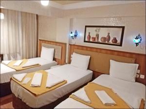 Postel nebo postele na pokoji v ubytování Istanbul Sydney Hotel