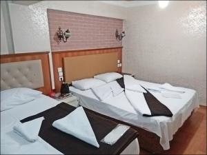 Postel nebo postele na pokoji v ubytování Istanbul Sydney Hotel
