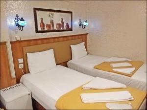Postel nebo postele na pokoji v ubytování Istanbul Sydney Hotel
