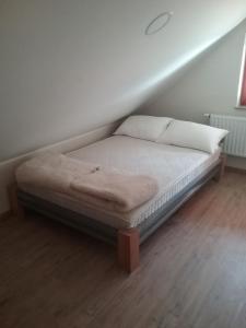 a bed in the corner of a room at Hudinja 111 in Vitanje