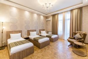 Postelja oz. postelje v sobi nastanitve Dat Exx Apartments on Marjanishvili