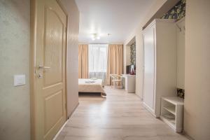 Postel nebo postele na pokoji v ubytování Sergeev Hotel