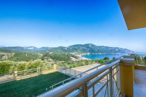 a balcony with a view of the water at Villa Sofia Amazing Views in Agios Georgios Pagon