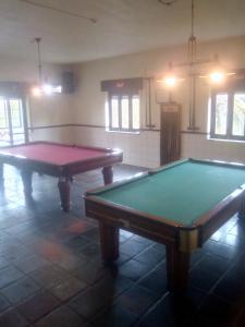 two ping pong tables sitting in a room at CABANA DO SOL in Torres Vedras