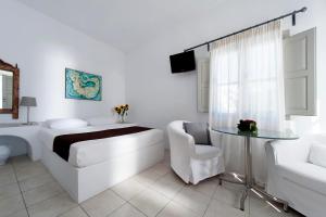 Postel nebo postele na pokoji v ubytování Gorgona Villas