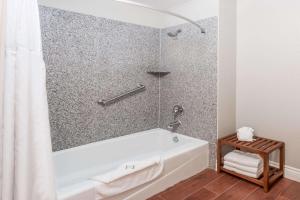 a bathroom with a tub and a shower at Casa Blanca Hotel - Orange in Orange +43 photos