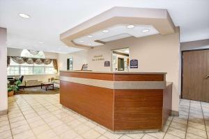 a lobby of a hospital with a reception desk at Microtel Inn & Suites by Wyndham Mason in Mason