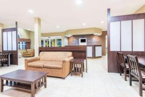 a lobby of a hospital with a couch and a table at Microtel Inn and Suites Montgomery in Montgomery