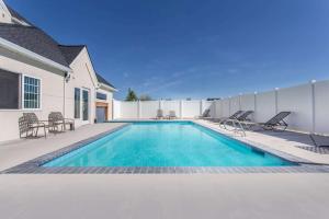 a swimming pool in the backyard of a house at Microtel Inn & Suites by Wyndham Klamath Falls in Klamath Falls