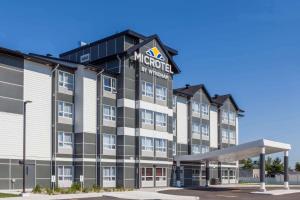 a rendering of the exterior of a hotel at Microtel Casselman in Casselman