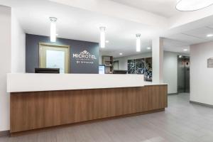 a lobby of a hospital with a reception counter at Microtel Casselman in Casselman