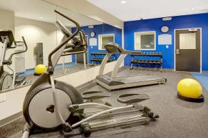 a gym with a treadmill and a exercise bike at Microtel Inn & Suites by Wyndham Philadelphia Airport Ridley Park in Ridley Park