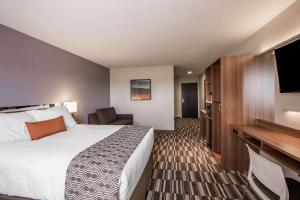 Ένα ή περισσότερα κρεβάτια σε δωμάτιο στο Microtel Inn & Suites by Wyndham Tioga