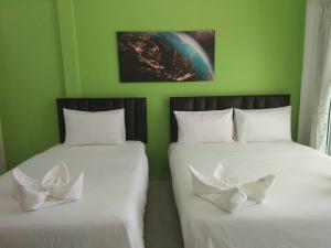 Postel nebo postele na pokoji v ubytování Thipburee Resort