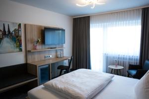 Postel nebo postele na pokoji v ubytování Hotel Wilms