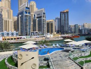 a large body of water with buildings at Pearl Marina Hotel Apartments in Dubai