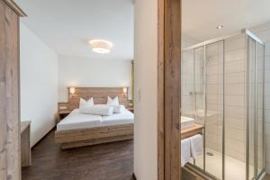 Łóżko lub łóżka w pokoju w obiekcie A Casa Saphir Appartement-Hotel