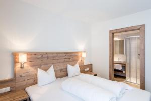 Łóżko lub łóżka w pokoju w obiekcie A Casa Saphir Appartement-Hotel