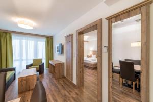 Łóżko lub łóżka w pokoju w obiekcie A Casa Saphir Appartement-Hotel