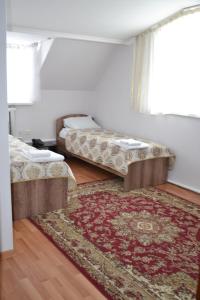 Łóżko lub łóżka w pokoju w obiekcie Bereke Hotel