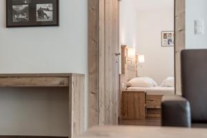 Łóżko lub łóżka w pokoju w obiekcie A Casa Saphir Appartement-Hotel