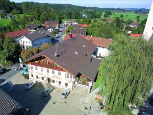 an overhead view of a house with a large tree at Gasthof Alter Wirt in Bernau am Chiemsee