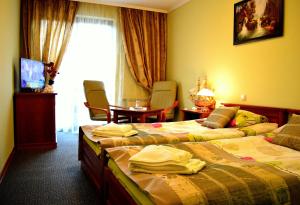 Posteľ alebo postele v izbe v ubytovaní Hotel Spinaker