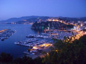 a harbor with boats in the water at night at B&B Il Convento in Agropoli +17 photos