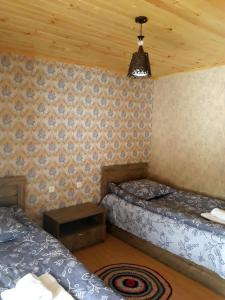 מיטה או מיטות בחדר ב-Irina's Guesthouse