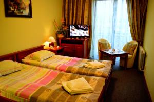 Posteľ alebo postele v izbe v ubytovaní Hotel Spinaker