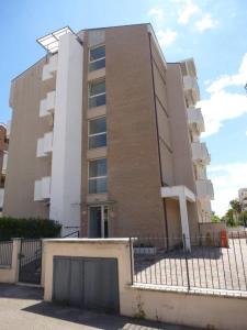 a building with a gate in front of it at Appartamento Iolanda in Tortoreto Lido