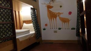 Postelja oz. postelje v sobi nastanitve Matsu 1st Hostel