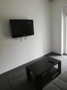 a living room with a flat screen tv on a wall at Tony apartment Split in Split