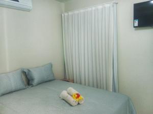 Ліжко або ліжка в номері Residence Delux Flecheiras