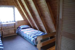 Postel nebo postele na pokoji v ubytování Sunrise Camp Łazy